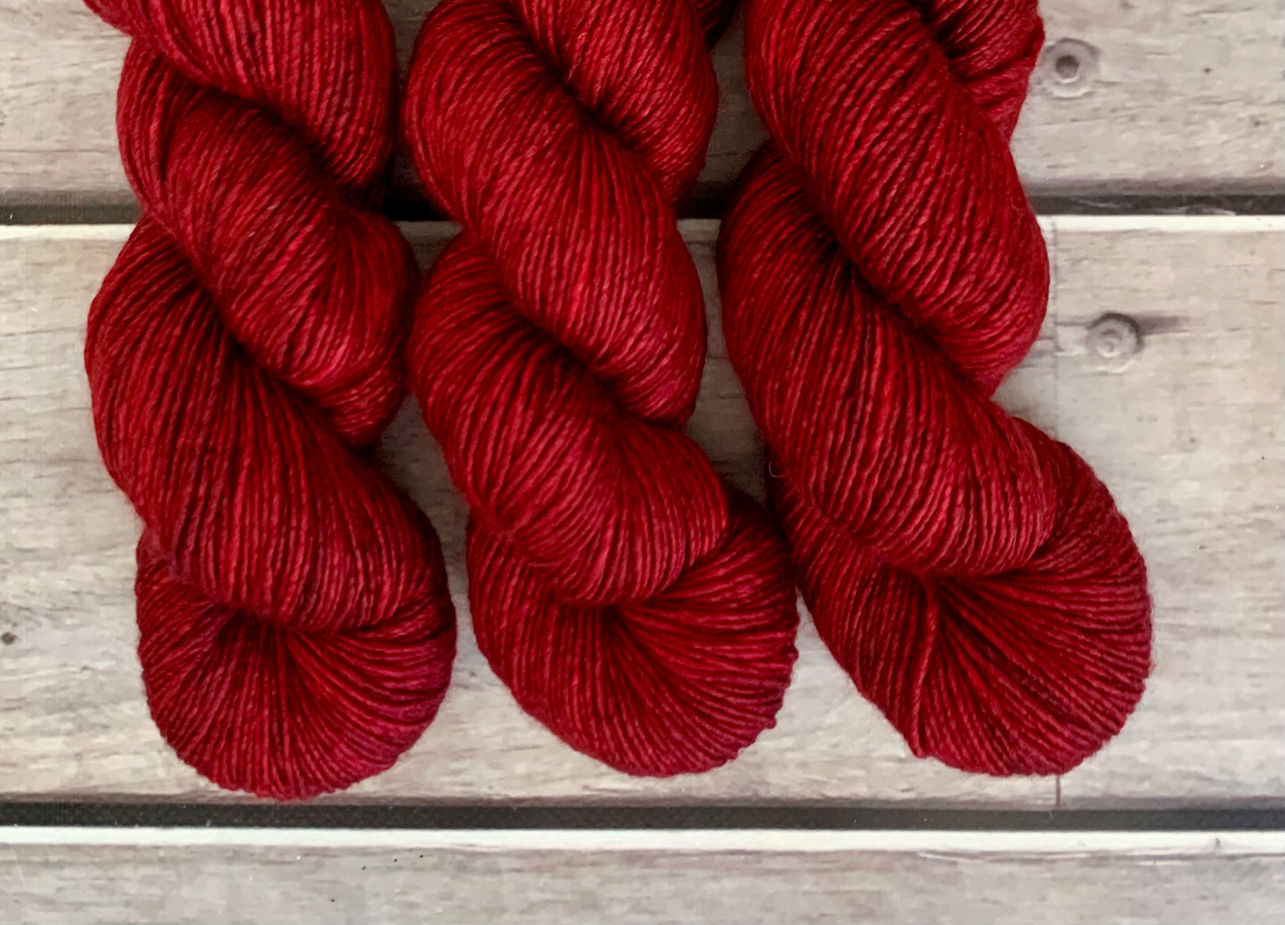 Dark Red Lacquer on Merino and Silk 8 ply single - Osmanthus 8