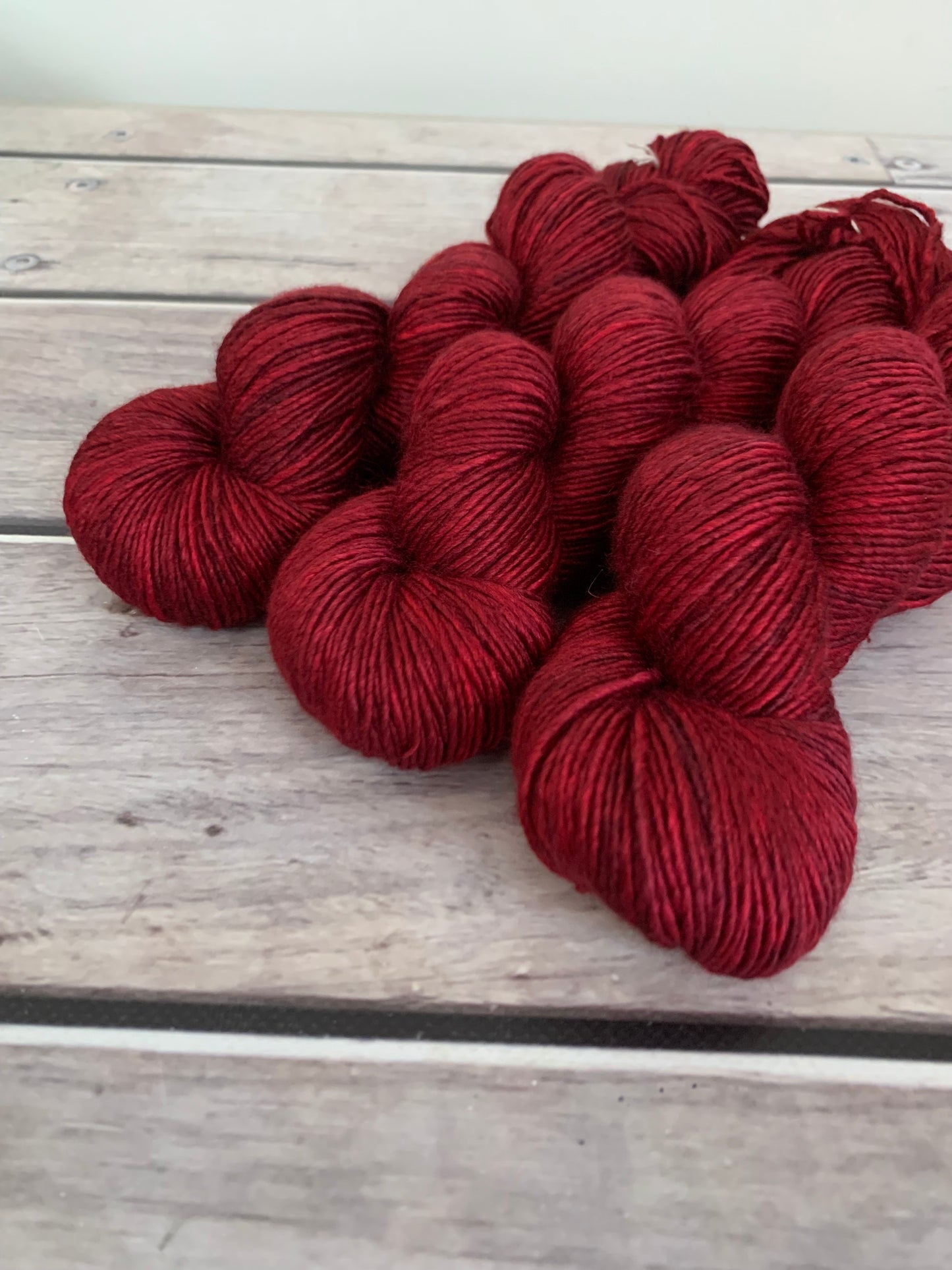 Dark Red Lacquer on Merino and Silk 8 ply single - Osmanthus 8