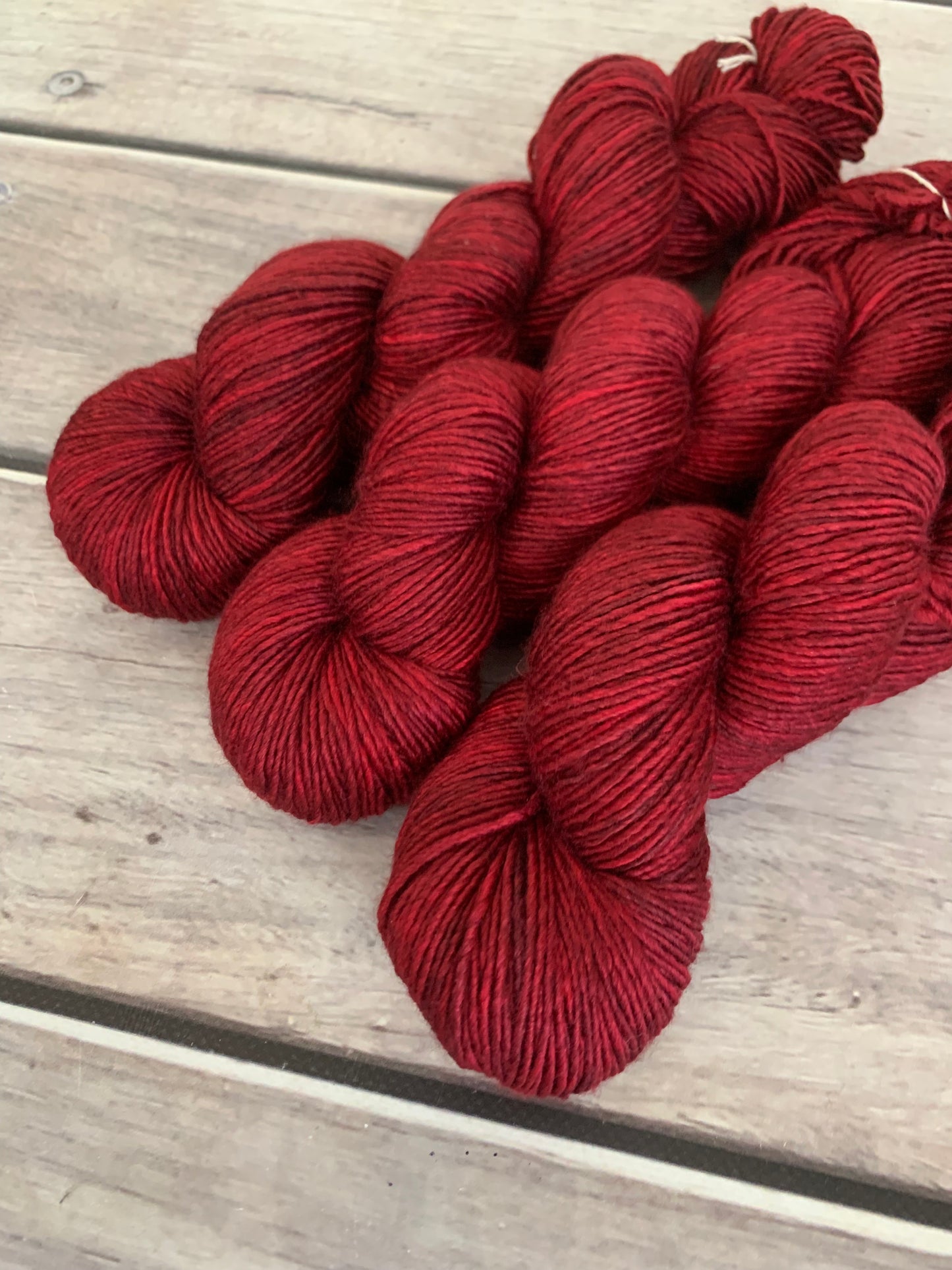 Dark Red Lacquer on Merino and Silk 8 ply single - Osmanthus 8